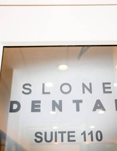 The front door of Slone Dental's office, Suite 110.
