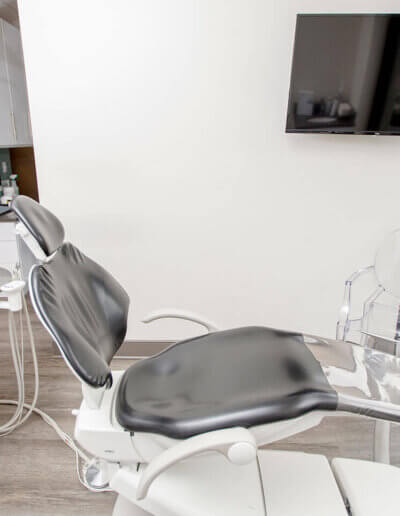 a dental chair in the Slone Dental office shown alongside modern equipment.